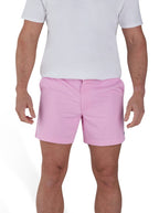 Man wearing a white t-shirt and stretch chino short in pink. 
