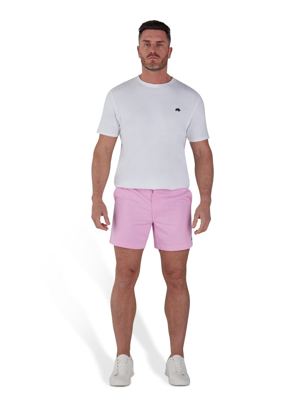 Man wearing pink shorts and white organic t-shirt.