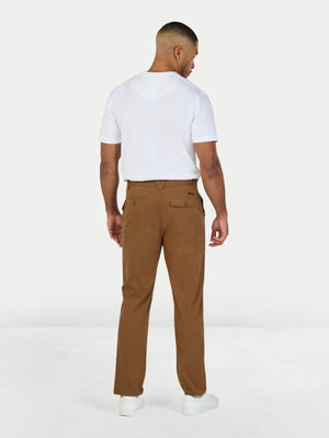 Man wearing a white t-shirt and brown pants on a white background
