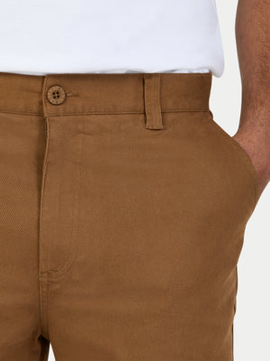 Brown pants with a button on a white background