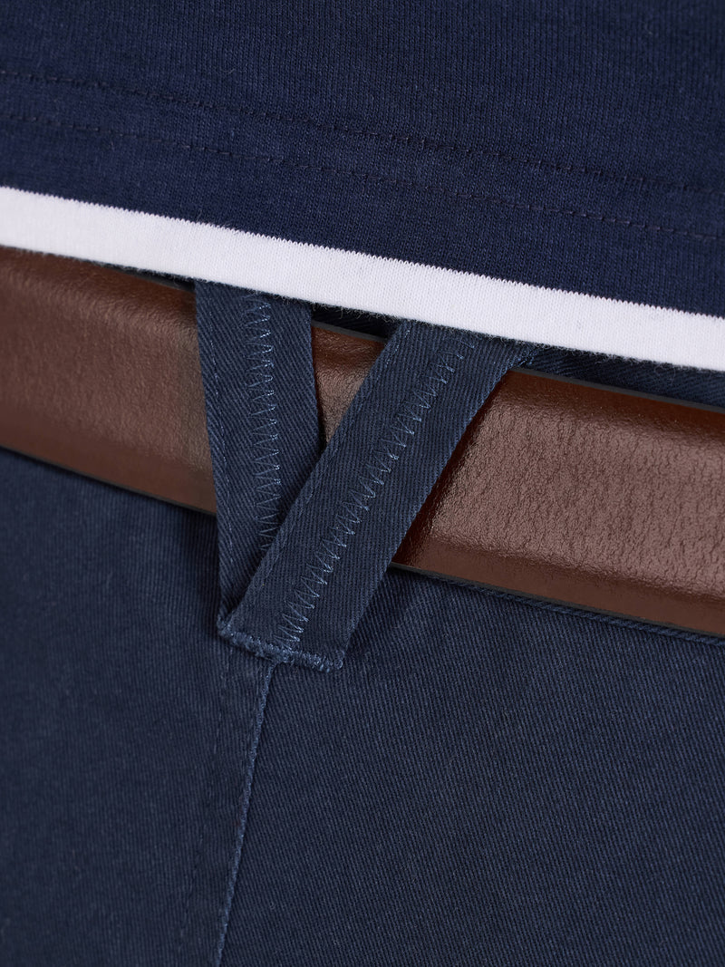 Close-up of navy pants with a brown belt and white stripe.