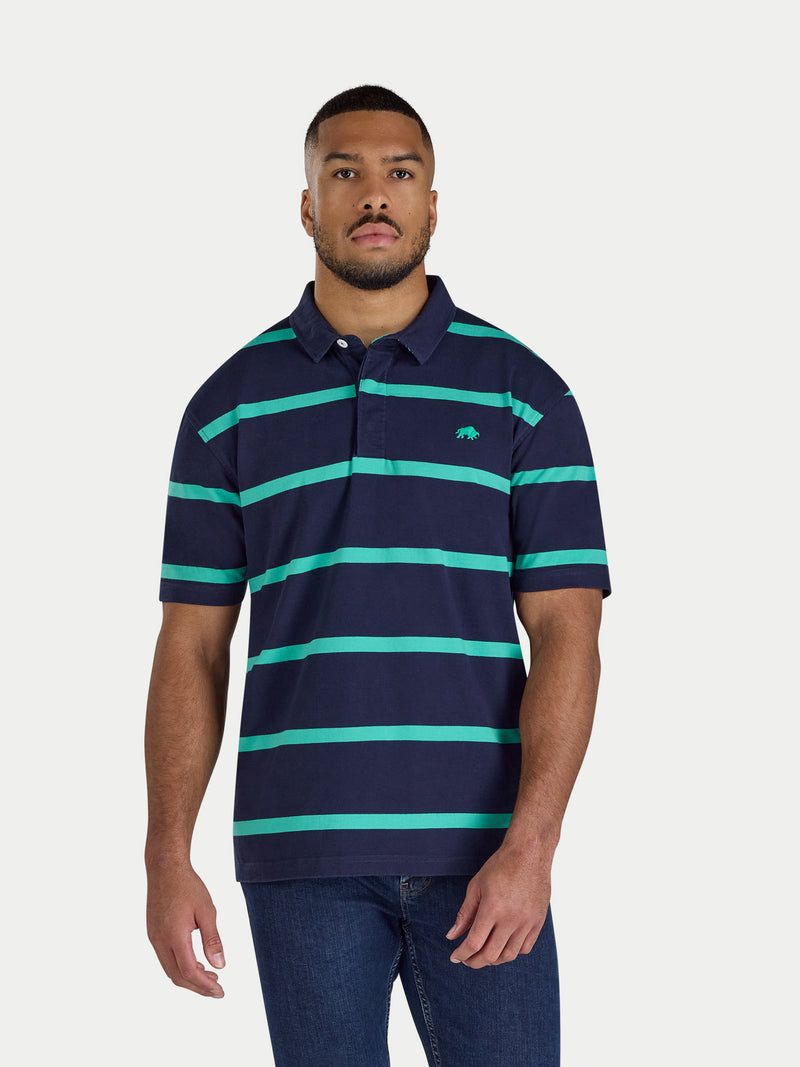 Man wearing a navy and green striped polo shirt on a white background