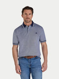Man wearing a blue polo shirt with white stripes on a light gray background