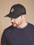 Man wearing a Raging Bull Tri colour mesh back cap in black, side detail.