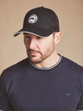 Man wearing a Raging Bull Tri colour mesh cap in black, front.