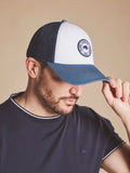 Man wearing a Raging Bull Tri Colour mesh back cap in Mid Blue, font. 