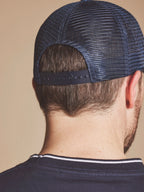 Man wearing a Raging Bull Tri Colour mesh back cap in Mid Blue, back. 