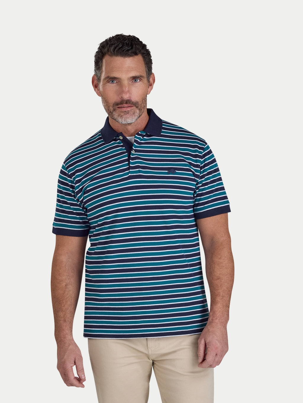 Man wearing a blue and green striped polo shirt on a white background