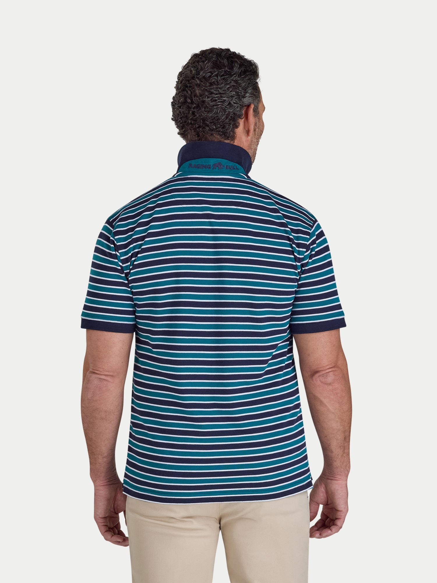 Man wearing a blue and green striped polo shirt on a white background