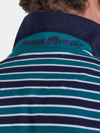 Close-up of a person wearing a navy and teal striped shirt with 'Raging Bull' branding.