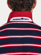 Navy, red, and white striped polo shirt with 'Raging Bull' logo on a plain background