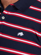 Navy blue polo shirt with red and white stripes and a logo on the chest.