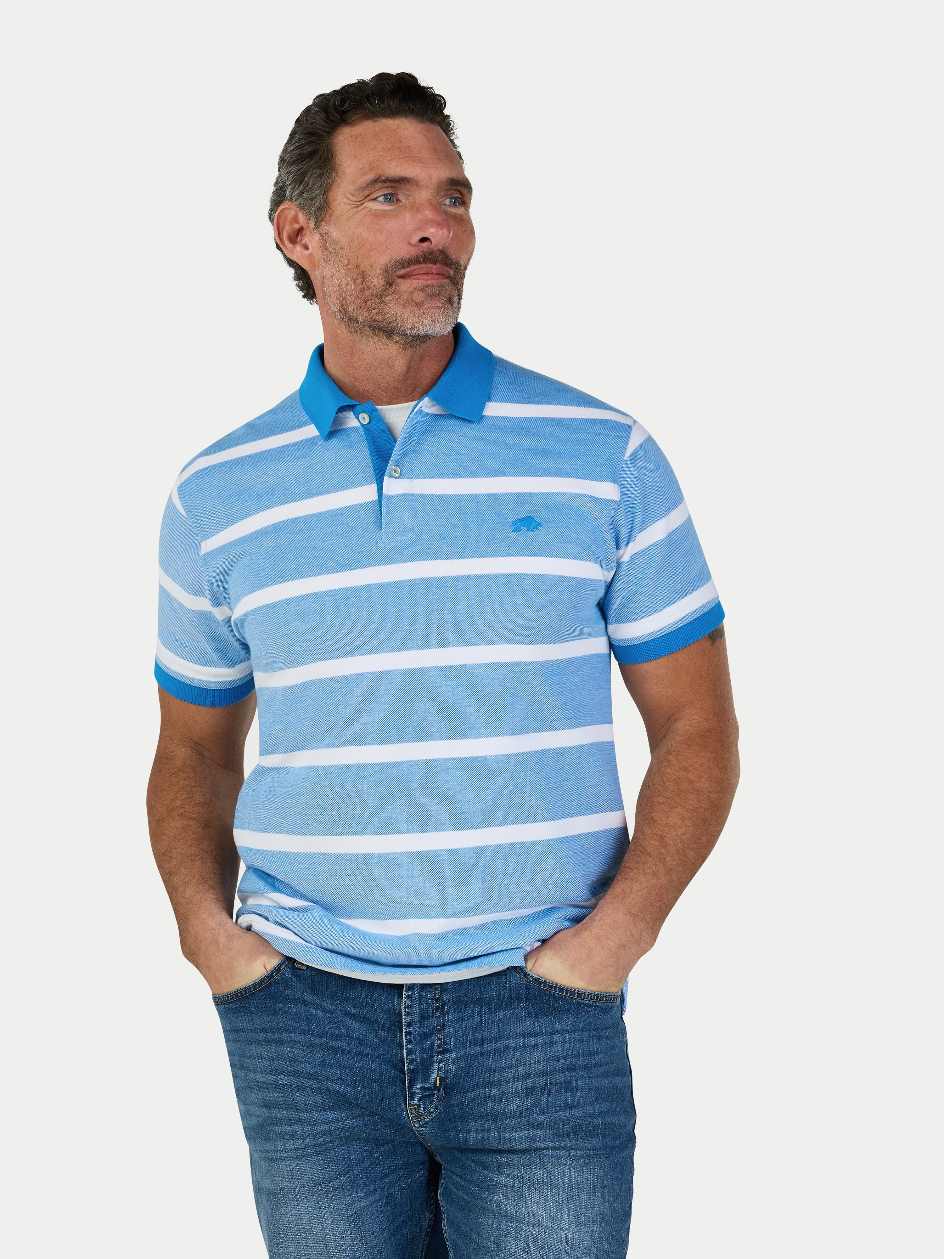 Man wearing a blue and white striped polo shirt on a light gray background