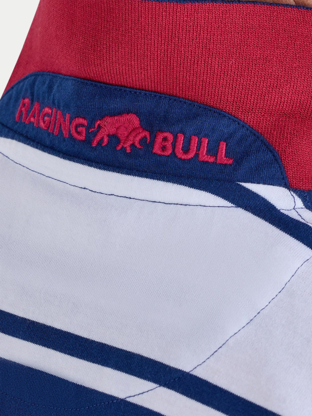 Close-up of a red, white, and blue fabric with 'Raging Bull' branding.