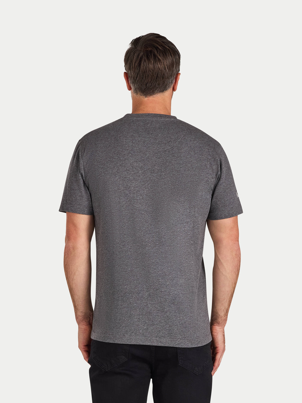 Man wearing a gray t-shirt on a white background