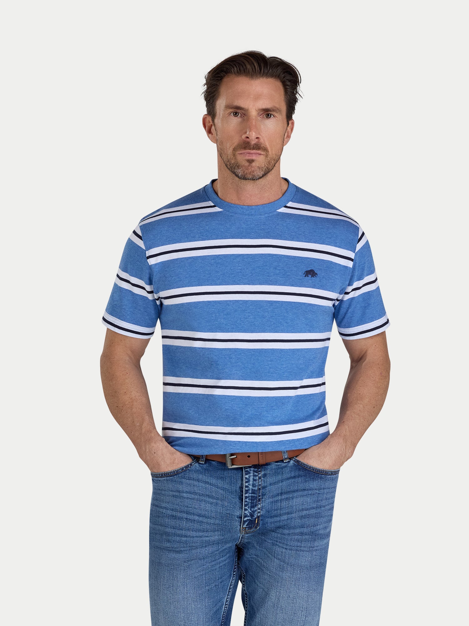 Man wearing a blue striped shirt and jeans on a white background