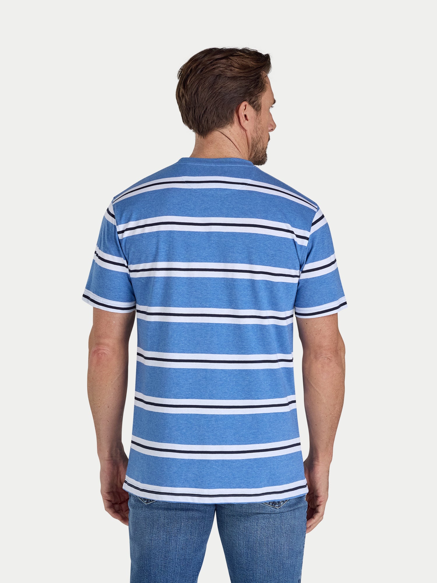 Man wearing a blue and white striped shirt on a plain background